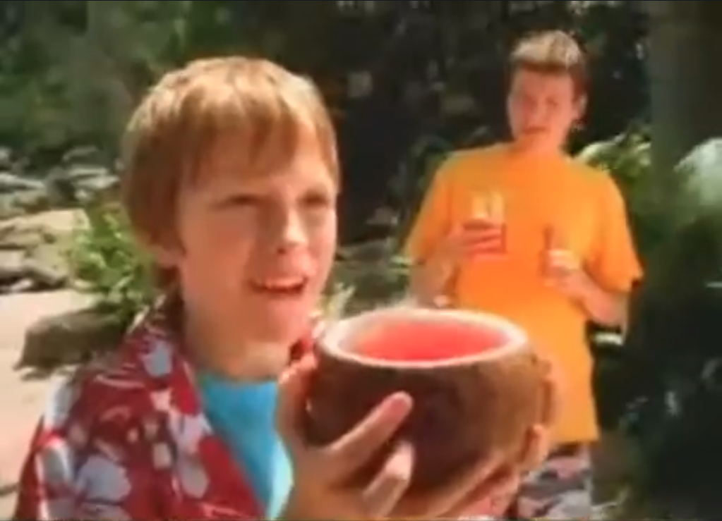 Still from Kool Aid SUS TV Commerical (2006) - A Boy Drinks Kool Aid from a Coconut